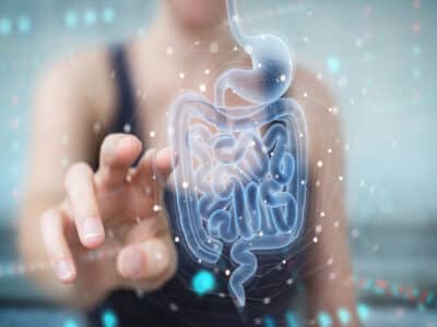 Woman on blurred background using digital x-ray of human intestine holographic scan projection 3D rendering