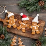 Gingerbread men on cutting board