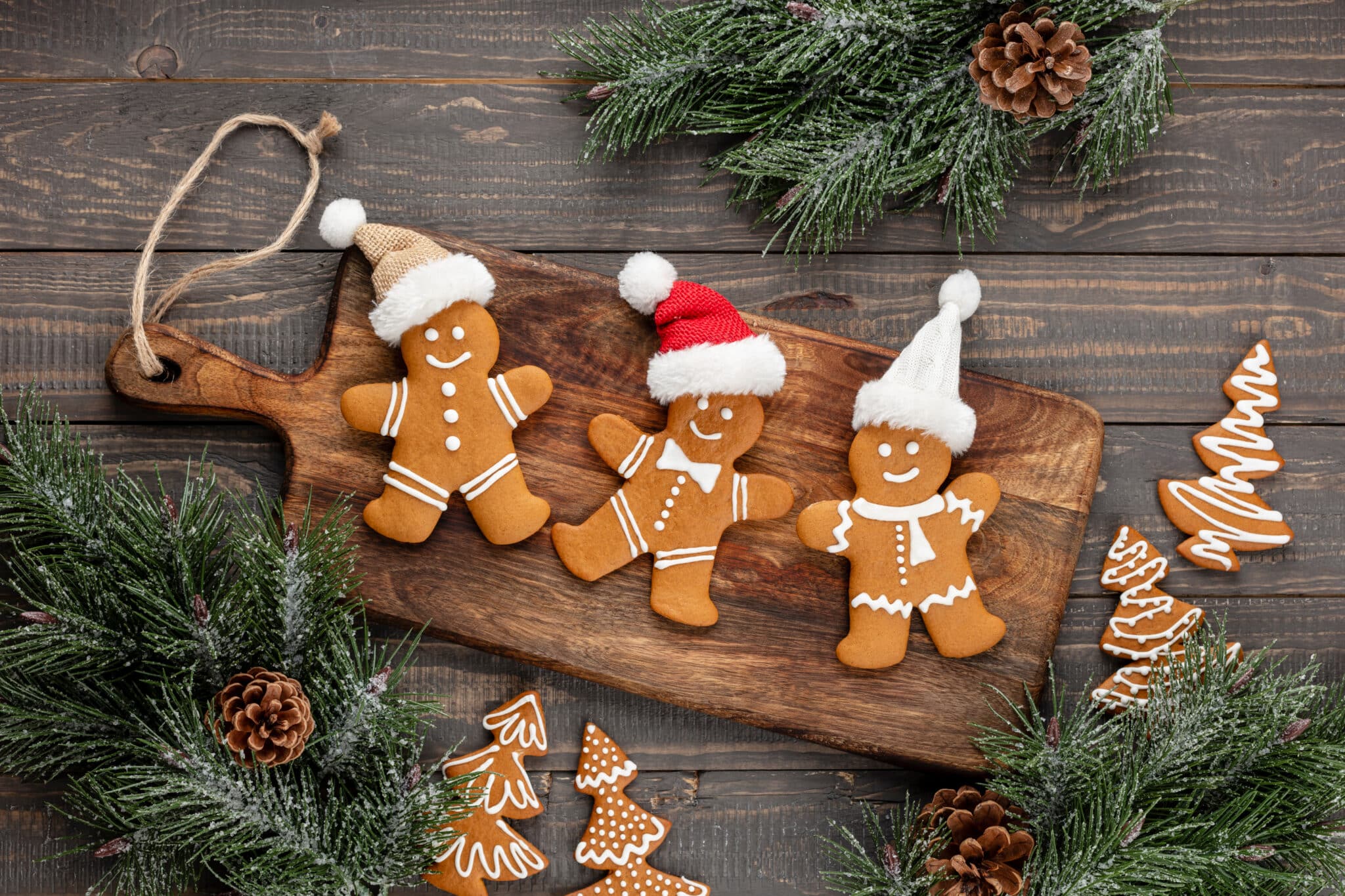 Gingerbread men on cutting board