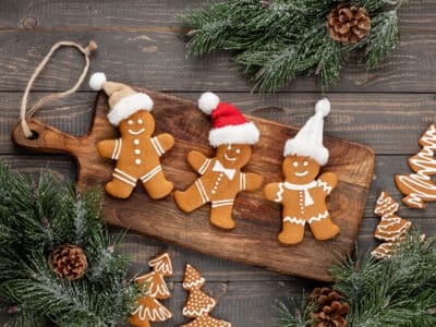 Gingerbread men on cutting board